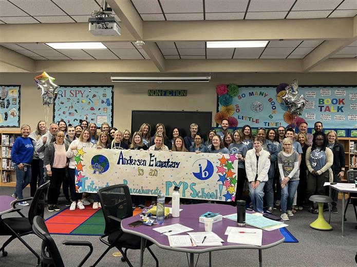 Andersen Elementary celebrate its IB PYP certification with staff members before fourth quarter starts.