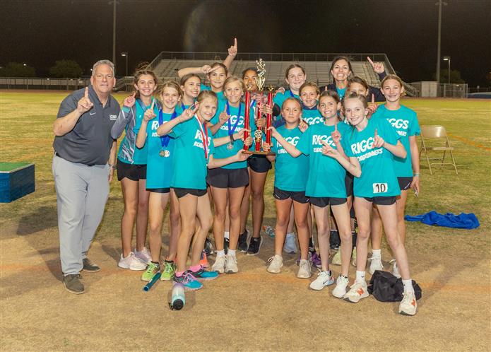  An image of Superintendent Frank Narducci with the Riggs Elementary Girls track team