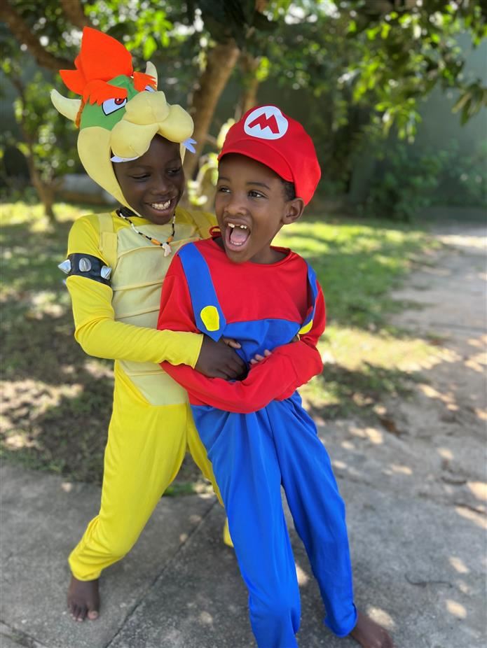 Cairo and Eli Koomson dressed as Bowser and Mario from "Super Mario Bros."
