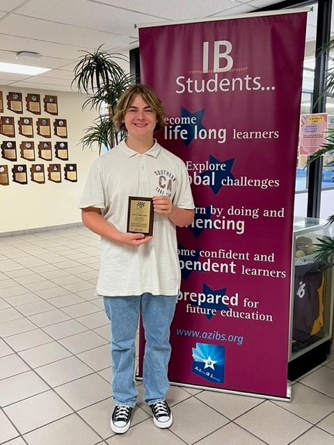  An image of Kyle DeRosier receiving his IB program award