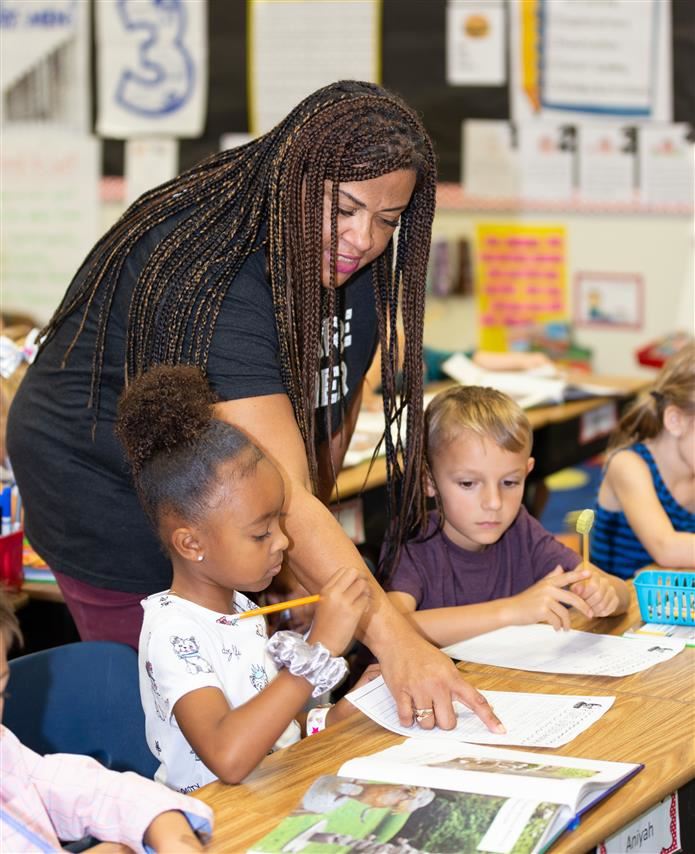 Kids with teacher in class