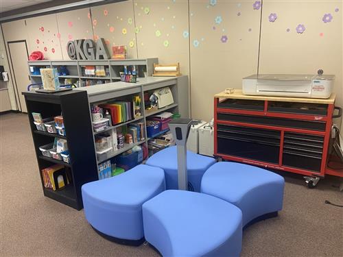 room with Blue seating and craft supplies