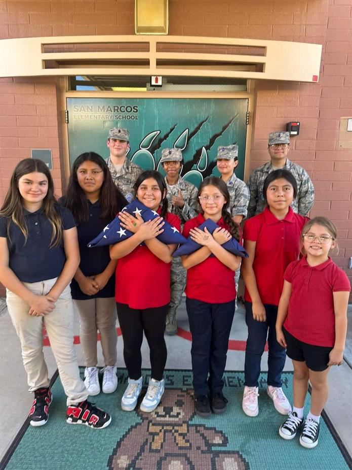  children holding the US Flag