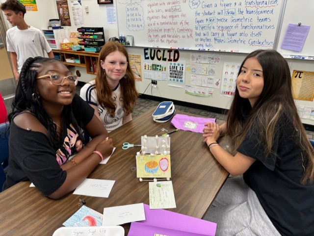  three students at a table