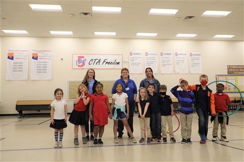 Picture of Cris Norton with Kids Express workers and kids.