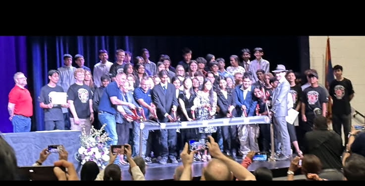 Student  Certificate Completers Cutting Ribbon