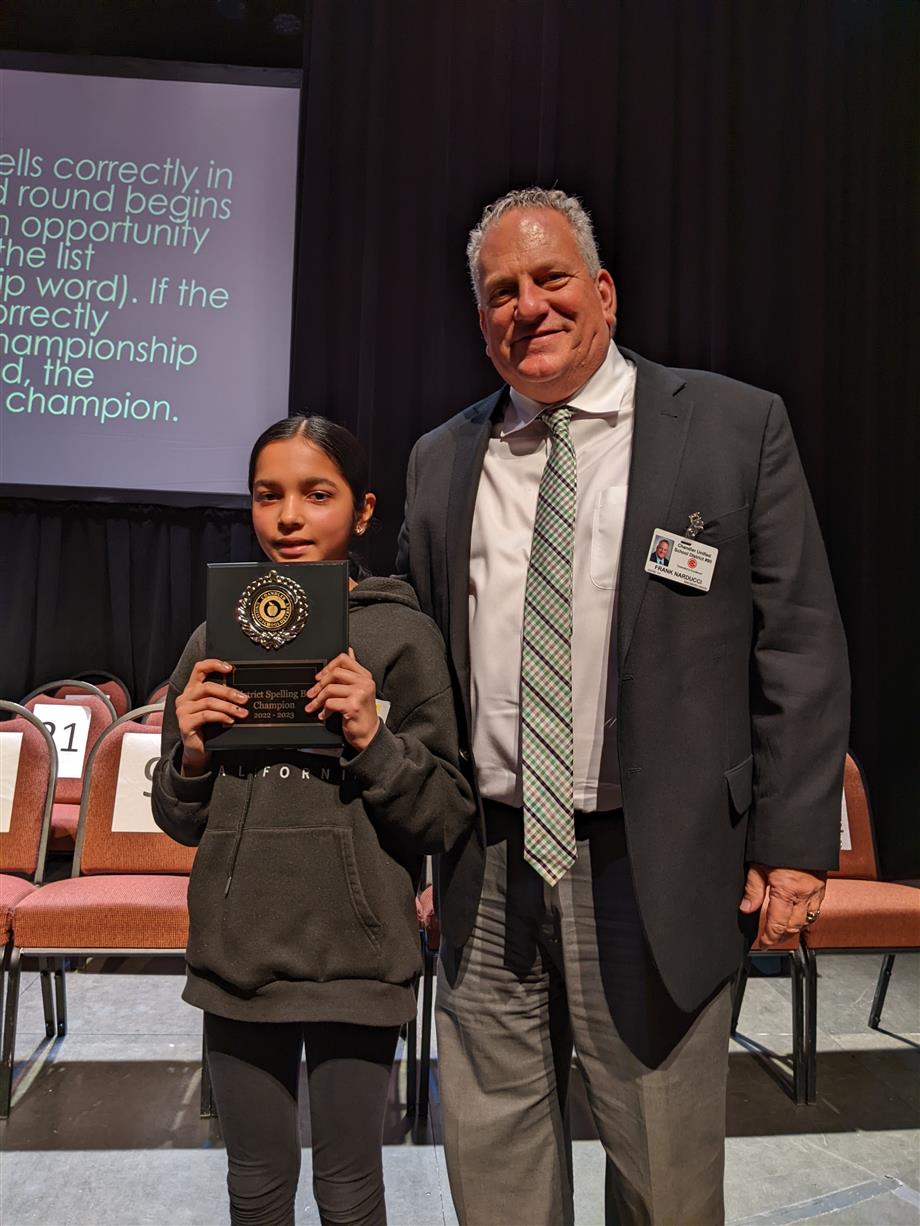 Opal Mishra from Basha Accelerated Middle School with Superintendent Frank Narducci