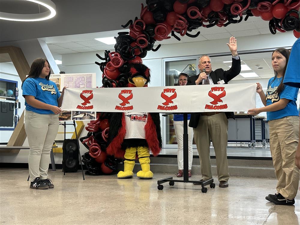 An image of CUSD Superintendent, Frye Principal, and students by a balloon arch.
