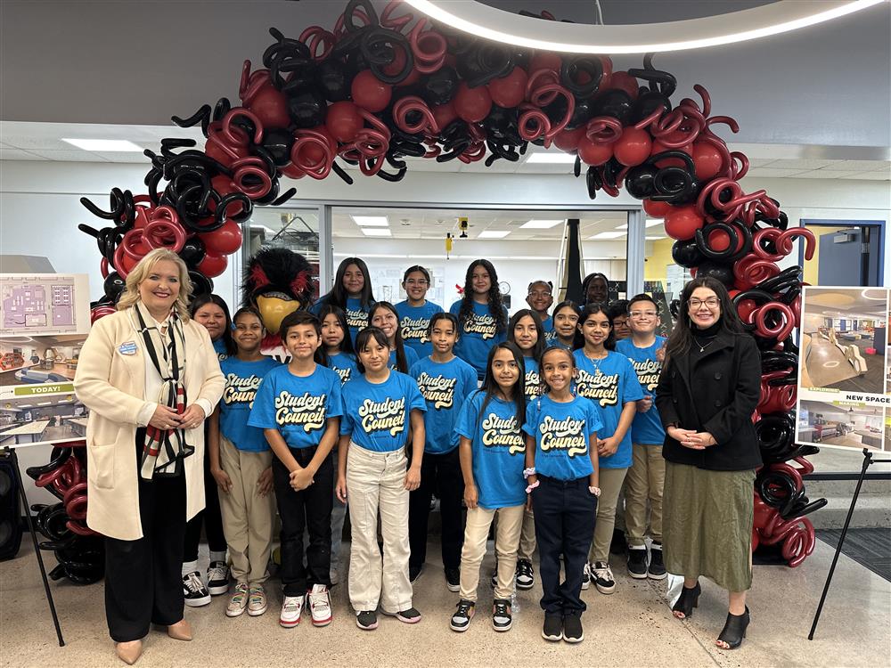 An image of a community leader with CUSD Governing Board president with the Frye Elementary Student Council members.