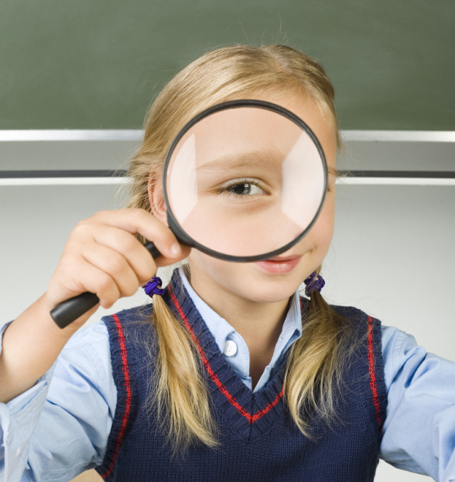 girl with magnifying glass